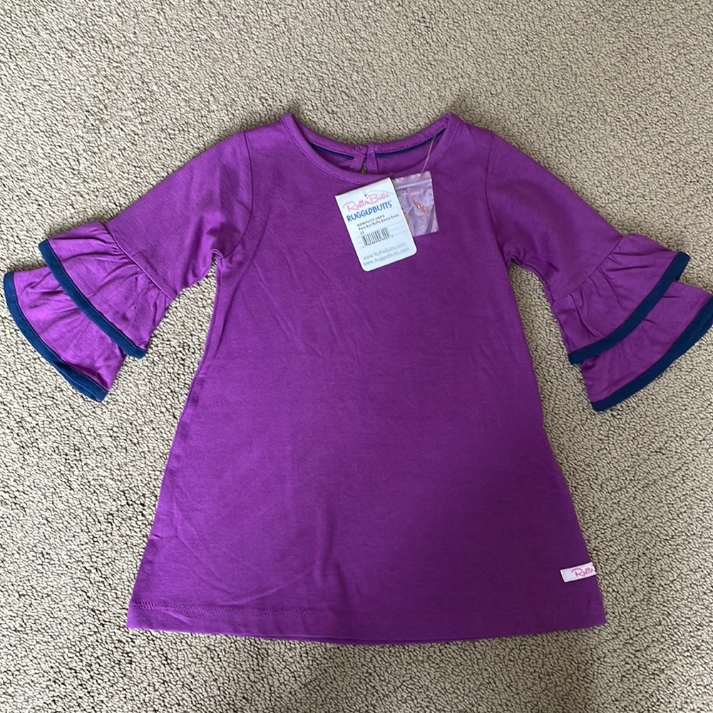 Brand new ruffle sleeve dress. Size 2T